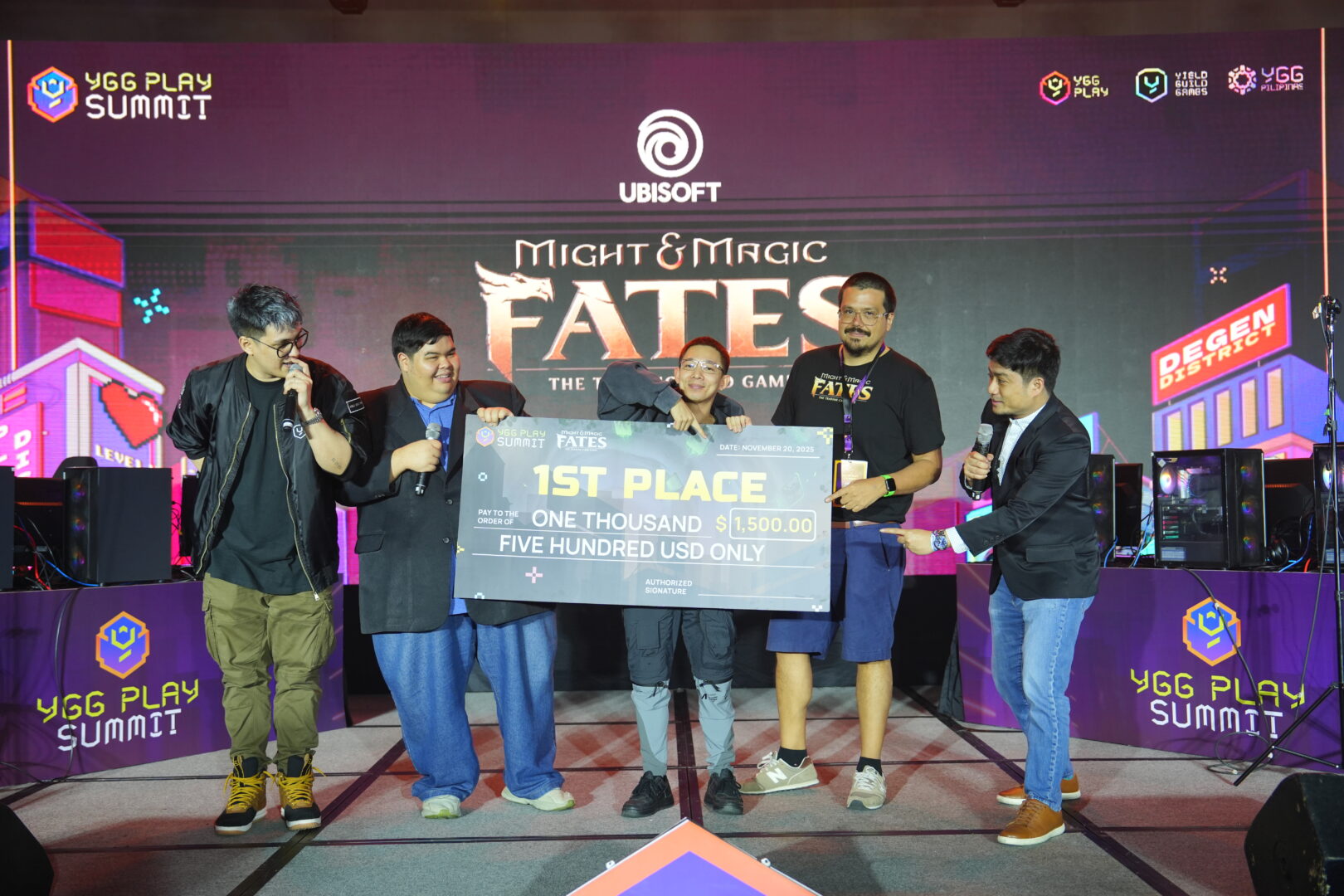 Ubisoft Executive Producer Sylvain Loe Mie awarding tournament champion on stage at YGG Play Summit 2025